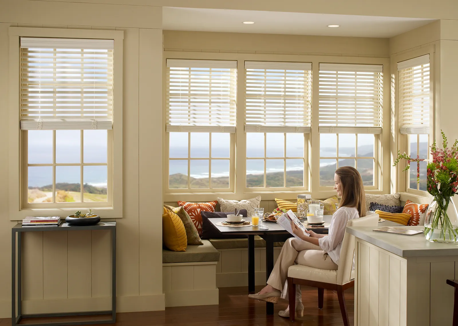 Modern kitchen with Lutron Palladiom roller shades for precise light control